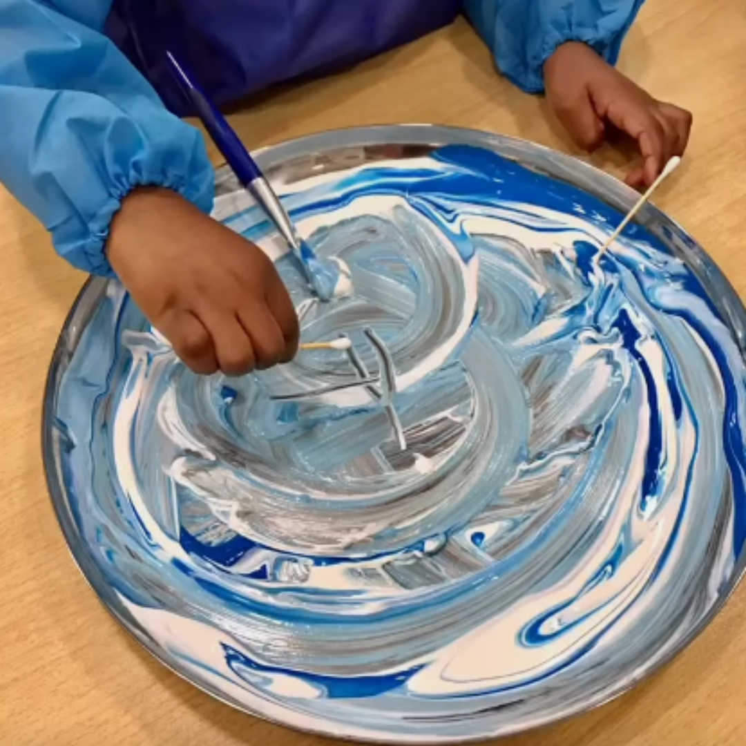 painting at stepping stones - colour mixing with blue and white