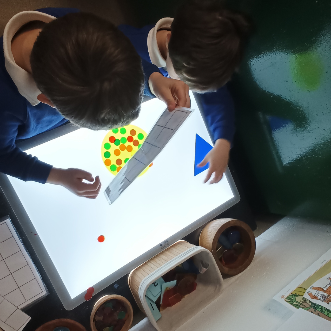 reception children experimenting with light