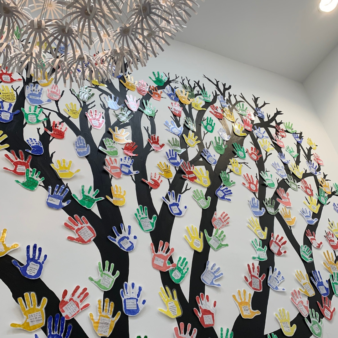 A tree display made of handprints